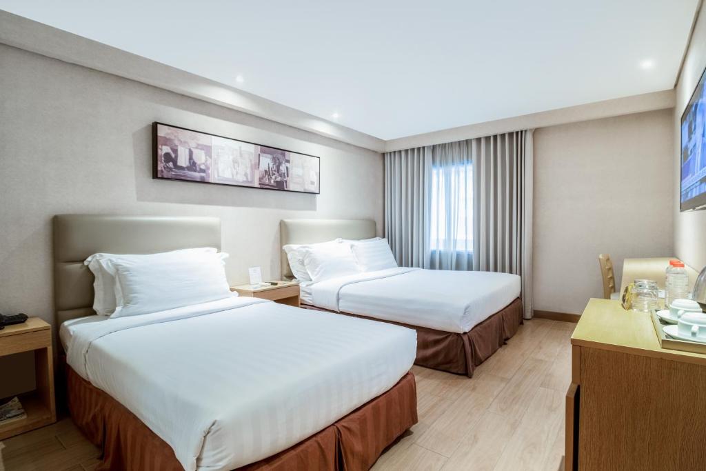 Postel nebo postele na pokoji v ubytování Jinjiang Inn - Ortigas