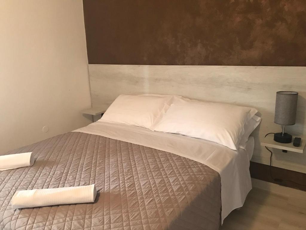 Postel nebo postele na pokoji v ubytování Albergo Ristorante Uspa