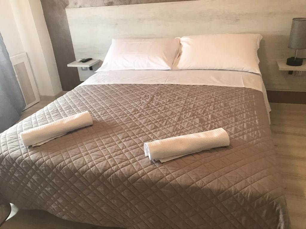 Postel nebo postele na pokoji v ubytování Albergo Ristorante Uspa