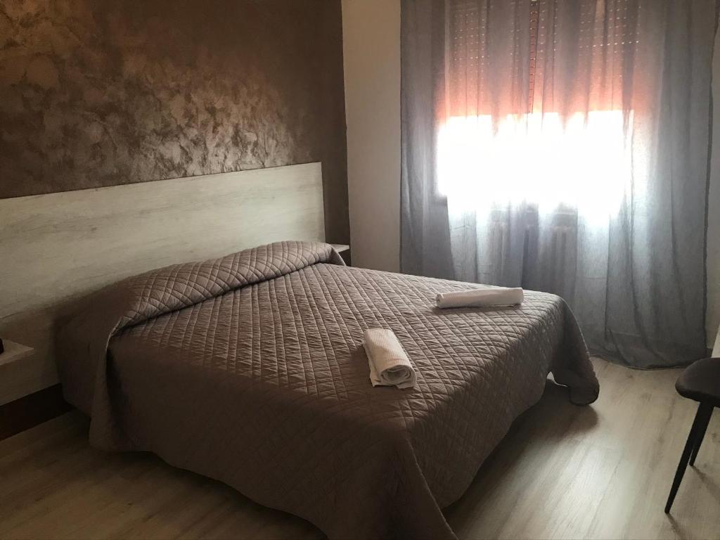 Postel nebo postele na pokoji v ubytování Albergo Ristorante Uspa
