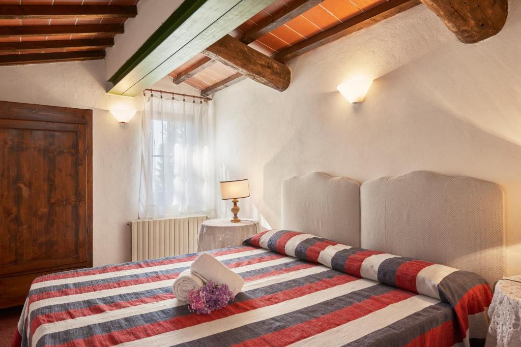 Postel nebo postele na pokoji v ubytování Agriturismo Pometti - Fattoria La Selva