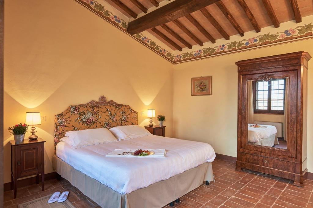 Postel nebo postele na pokoji v ubytování Agriturismo Pometti - Fattoria La Selva