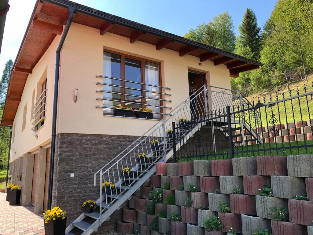 a house with stairs in front of it at Apartmán Tatiana in Terchová