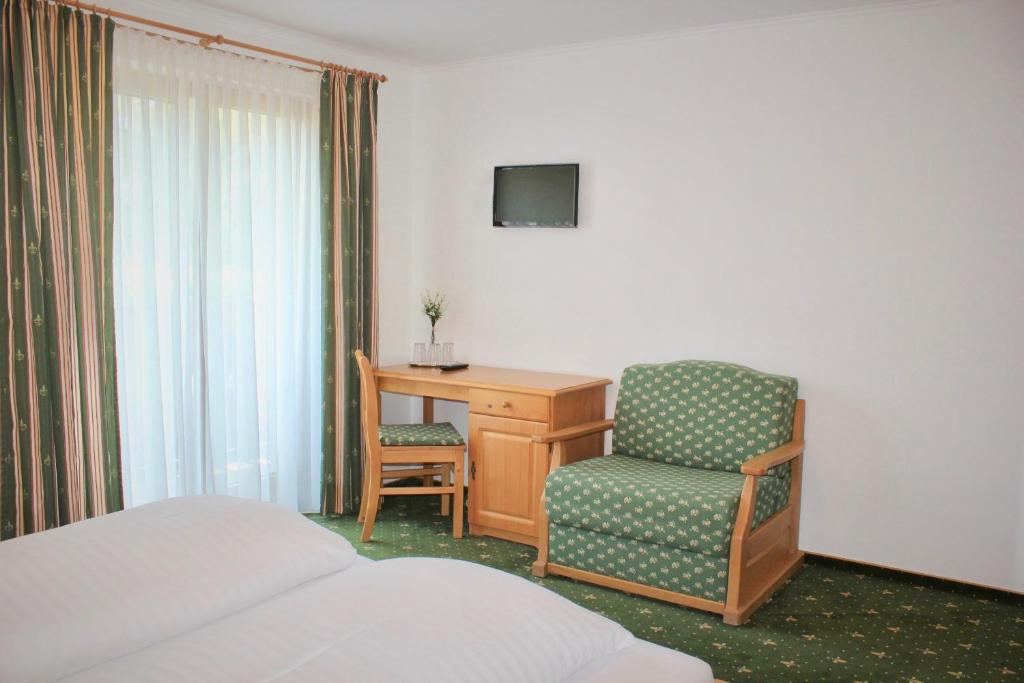 Postel nebo postele na pokoji v ubytování Hotel Alex