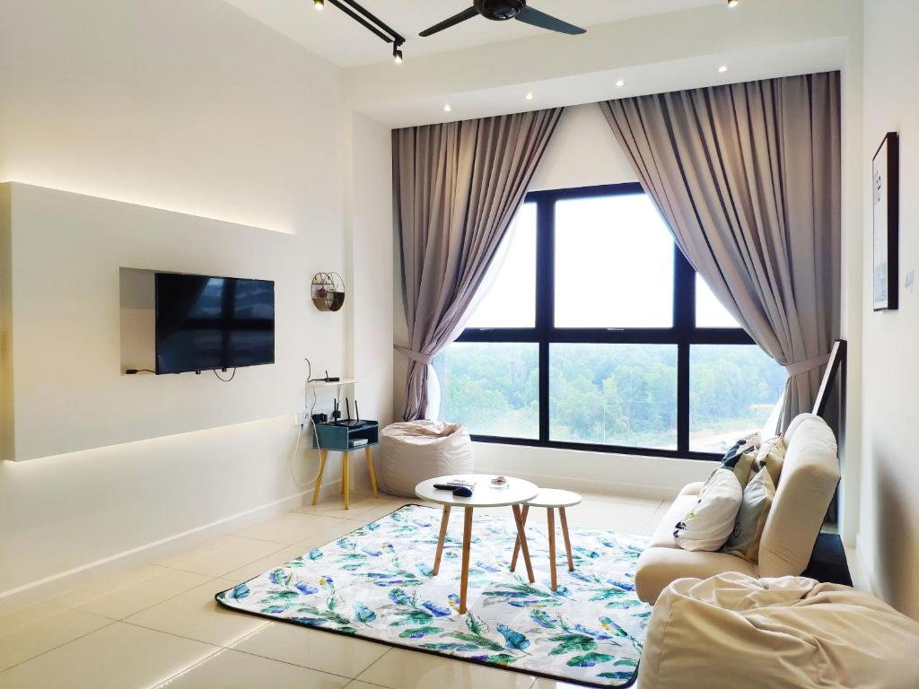a living room with a couch and a table at Le Pavilion by Salaam Suites, 5 pax, near Setiawalk in Puchong