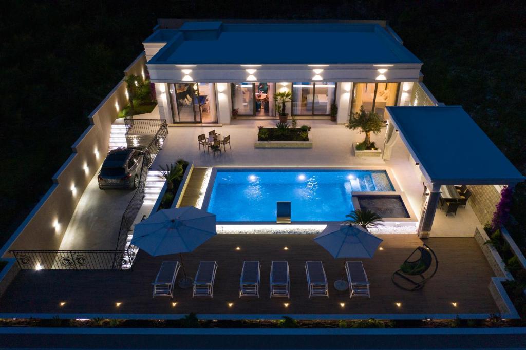 an aerial view of a house with a swimming pool at Villa Salute in Budva