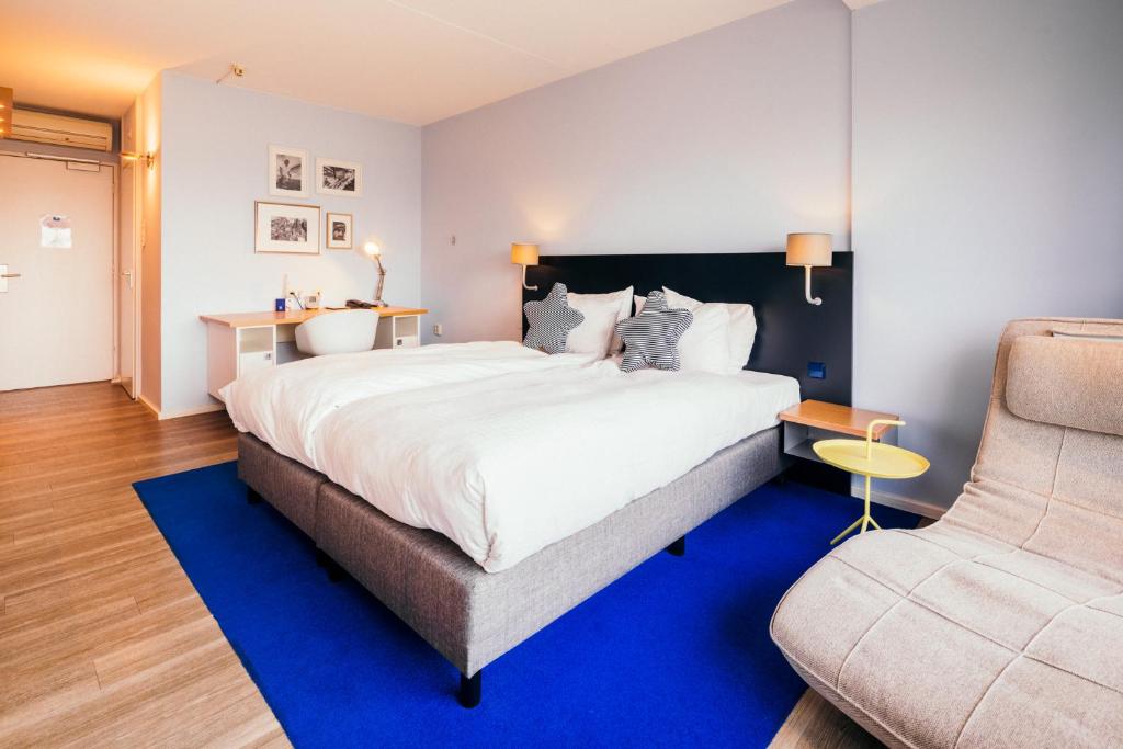Postel nebo postele na pokoji v ubytování Delta Hotel