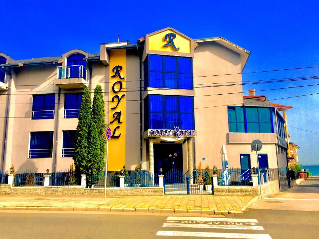 a building with a sign on the front of it at Boutique Hotel Royal in Nesebar
