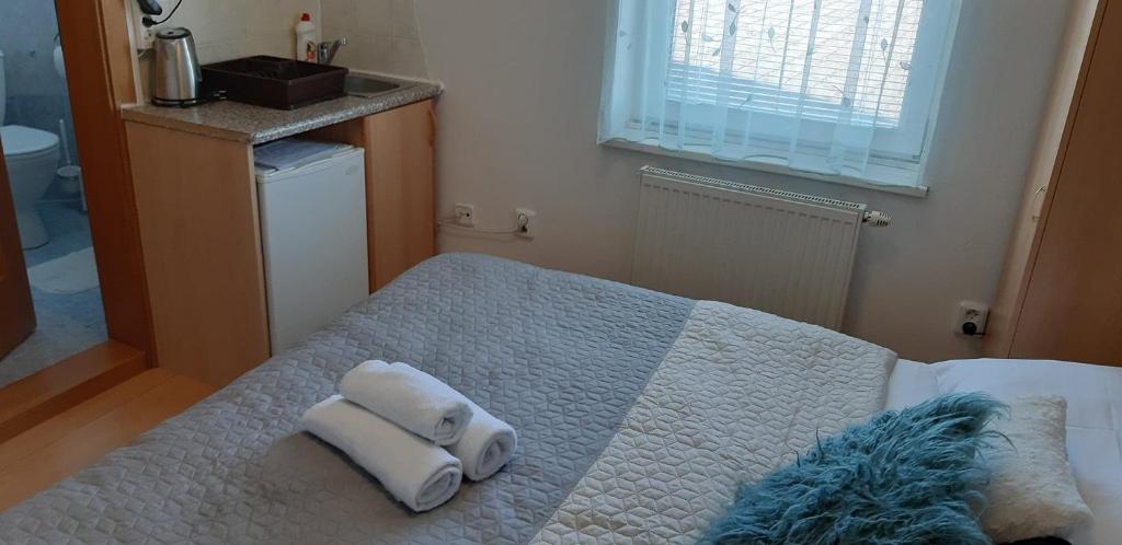 Postel nebo postele na pokoji v ubytování Guest House Maxim