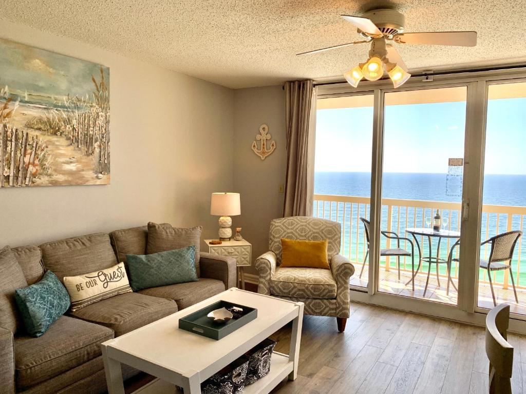 a living room with a couch and a table at Just Updated - Beachfront Ocean view, 19th Floor in Destin