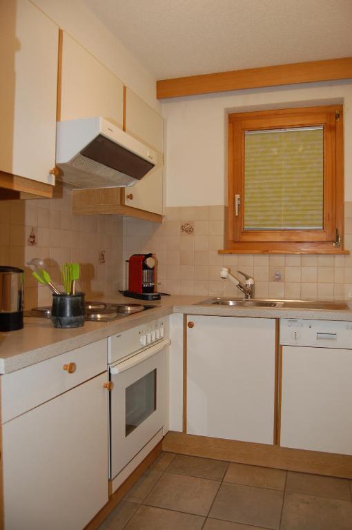 Kuchyň nebo kuchyňský kout v ubytování Apartment Swiss Chalet