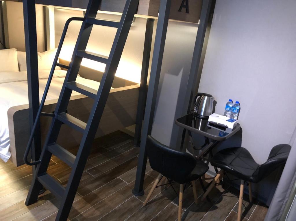 Rúm í herbergi á KIWI SHARE HOTEL ZHONGLI