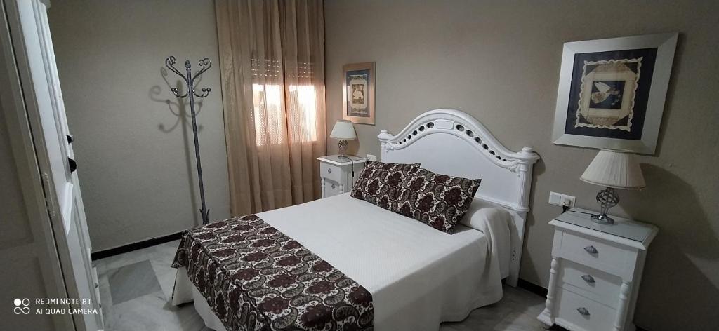A bed or beds in a room at Alojamiento casa típica de Córdoba