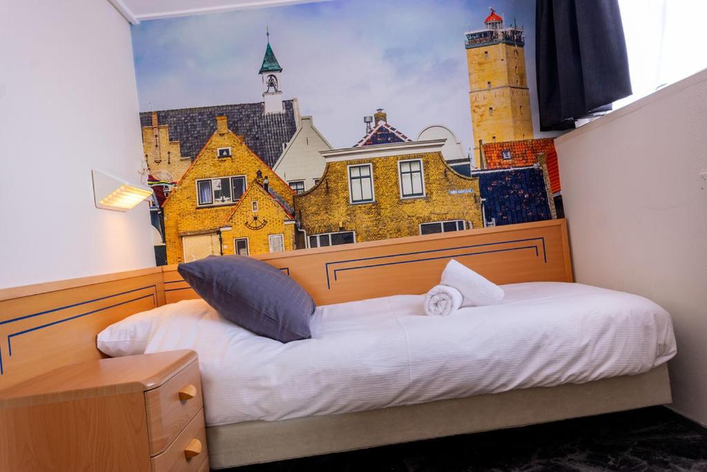 Postel nebo postele na pokoji v ubytování `t Wapen van Terschelling