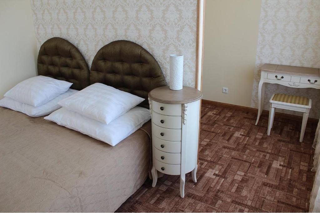 Postel nebo postele na pokoji v ubytování Villa & Restoran Soffa