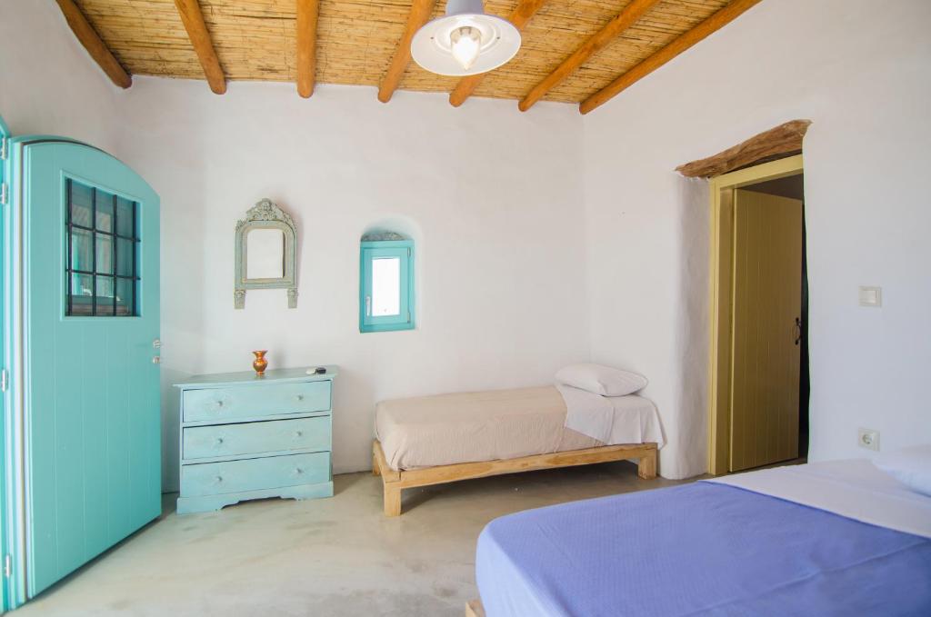 Postel nebo postele na pokoji v ubytování Dimitrakis Guesthouse