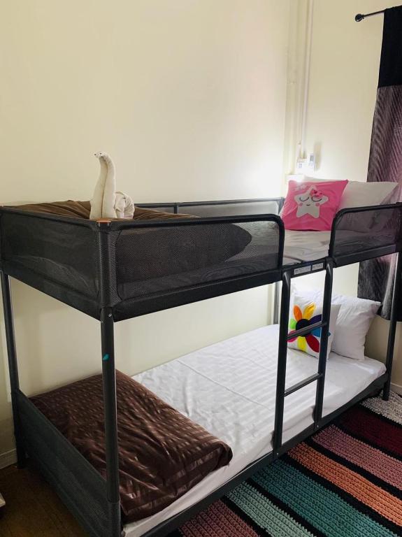 Postel nebo postele na pokoji v ubytování Baan Mae Somkid Homestay