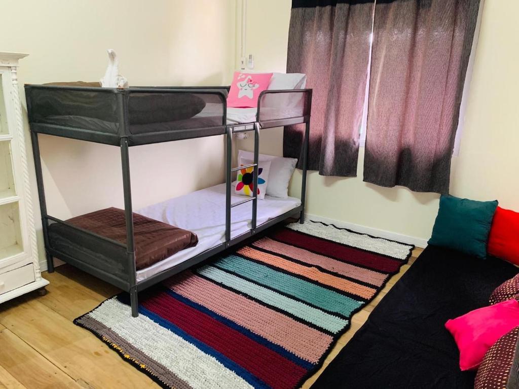 Postel nebo postele na pokoji v ubytování Baan Mae Somkid Homestay