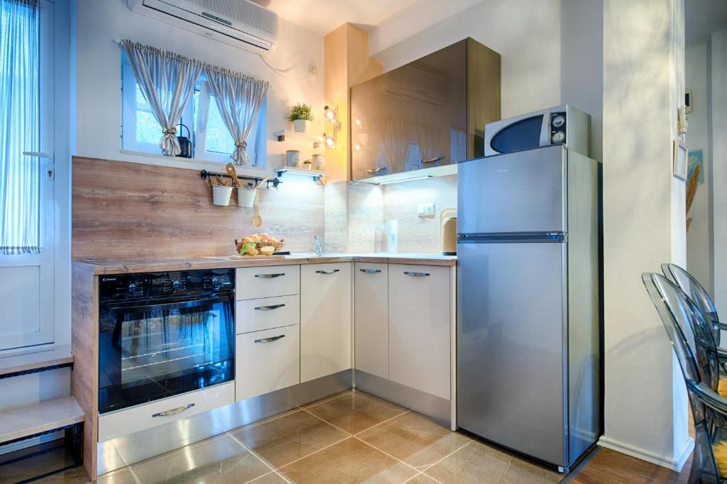 Kuchyň nebo kuchyňský kout v ubytování Apartments Dubra