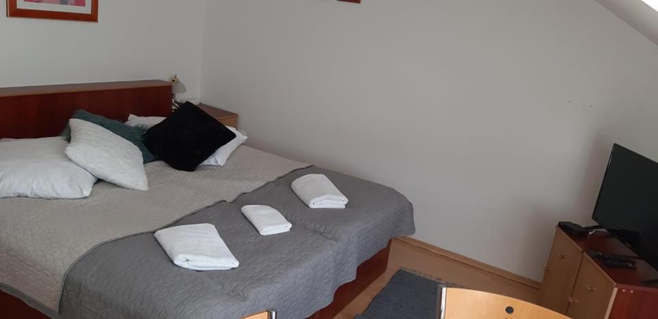 Postel nebo postele na pokoji v ubytování Guest House Maxim