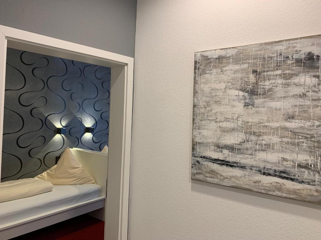 Postel nebo postele na pokoji v ubytování Hotel B54 Heidelberg City Center