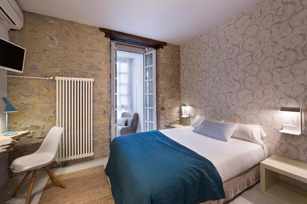 Postel nebo postele na pokoji v ubytování La Casa de Los Arquillos