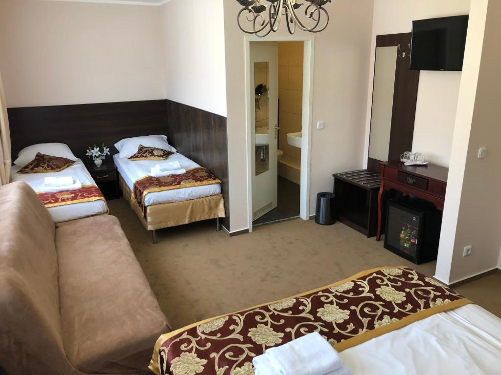 Postel nebo postele na pokoji v ubytování Atlas Berlin Hotel