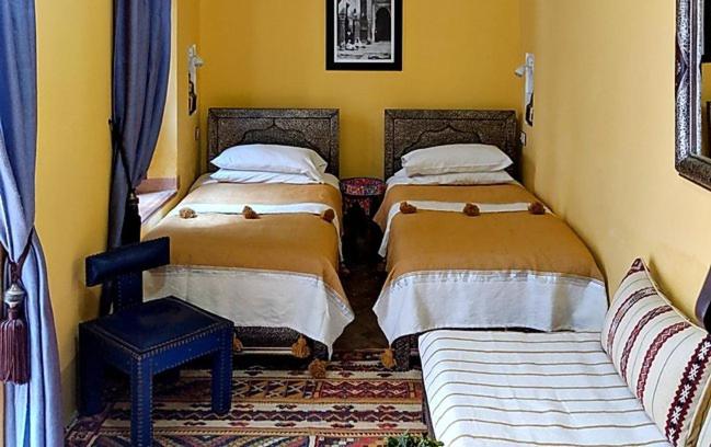 Postel nebo postele na pokoji v ubytování Riad Smara