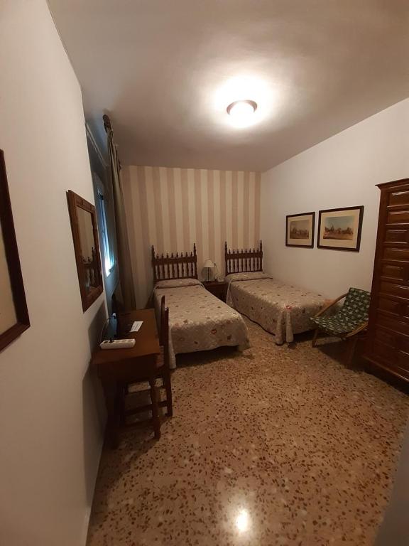Postel nebo postele na pokoji v ubytování Hotel Andalucía