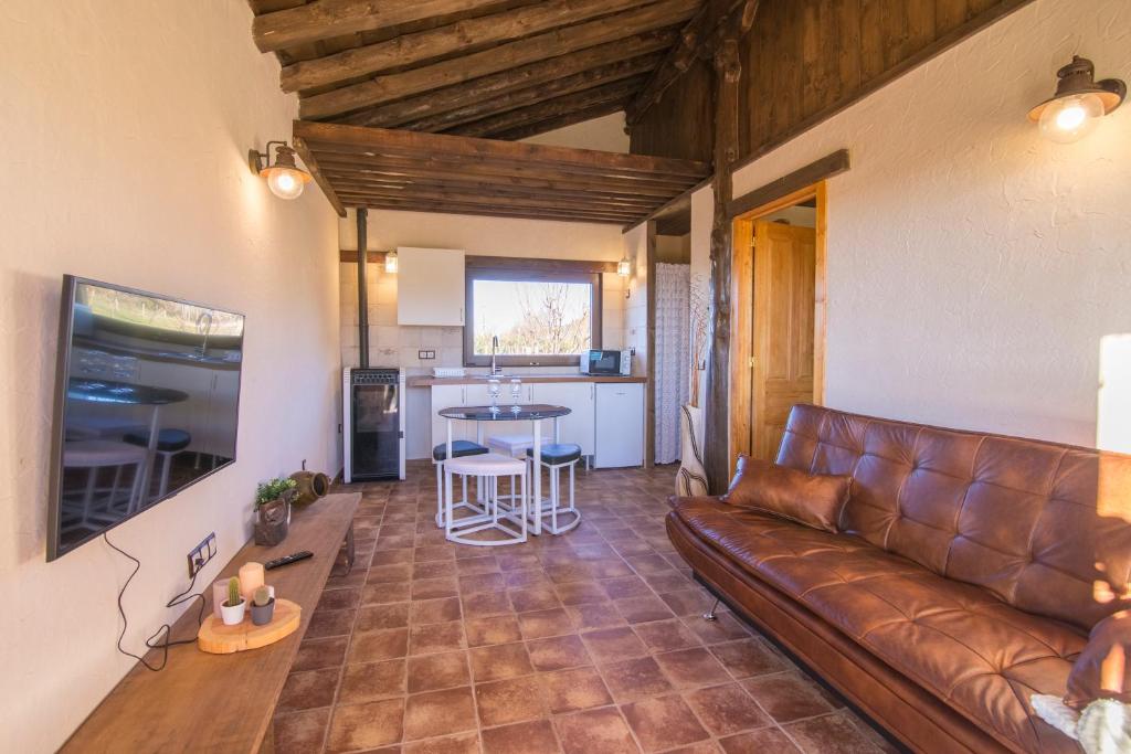 A seating area at El BURGO DE OSMA ALOJAMIENTO RURAL VILLA BAGH
