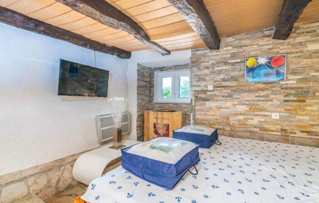 Posteľ alebo postele v izbe v ubytovaní Stone House Knez