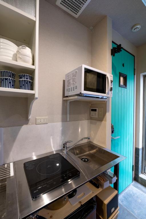 Kuchyň nebo kuchyňský kout v ubytování Room Inn Shanghai 横浜中華街 Room3