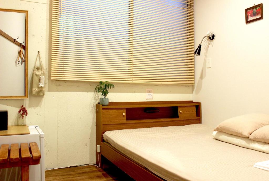 Postel nebo postele na pokoji v ubytování Hostel TOKI