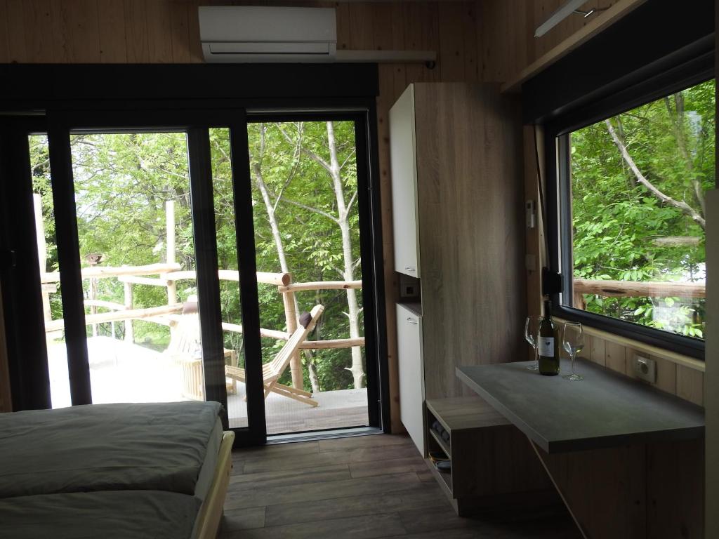 Postel nebo postele na pokoji v ubytování Počitniški hišici - Small holiday houses