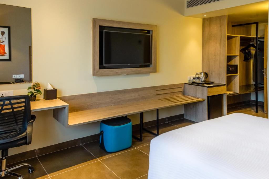 Postel nebo postele na pokoji v ubytování Amika Hotel,Madurai - Near Airport
