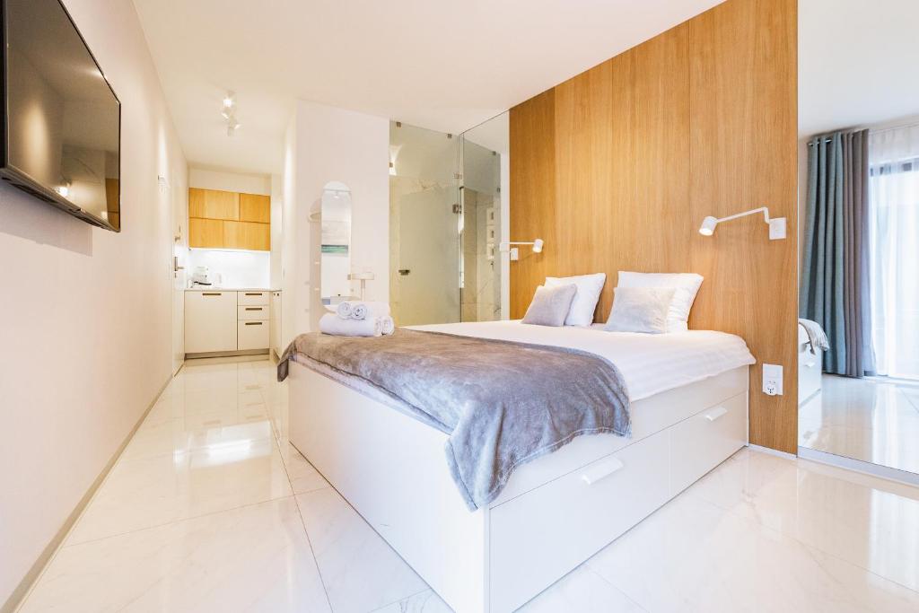 Posteľ alebo postele v izbe v ubytovaní Odra View Apartments III