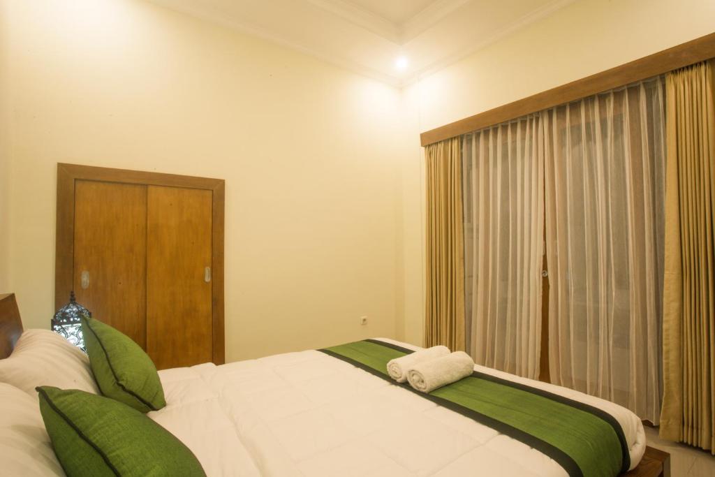 Postel nebo postele na pokoji v ubytování Monka House