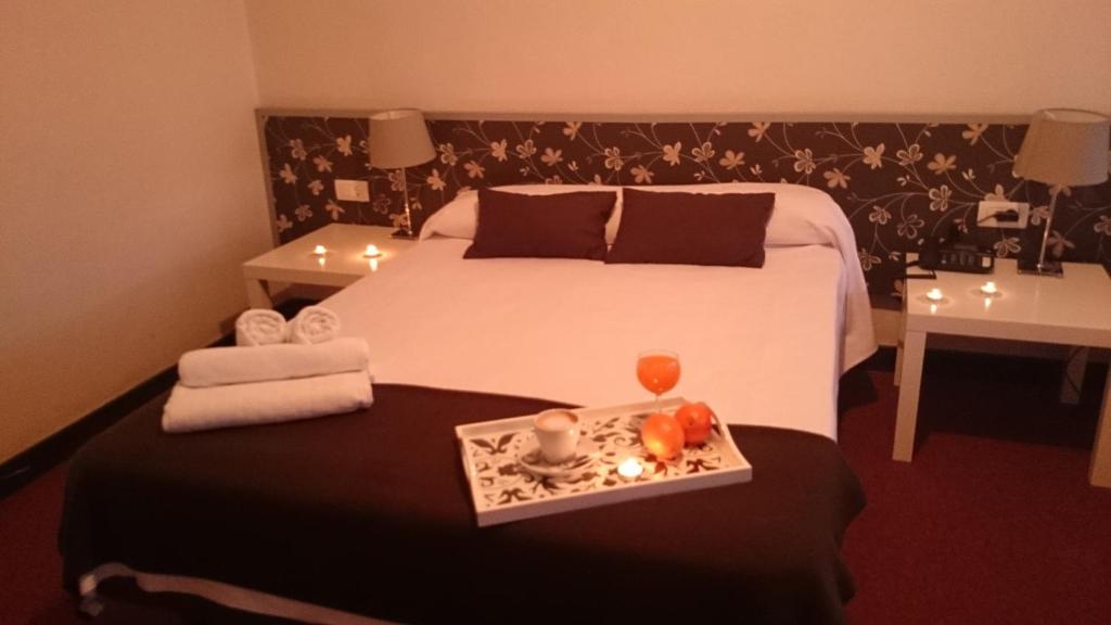 Postel nebo postele na pokoji v ubytování Hotel San Blas