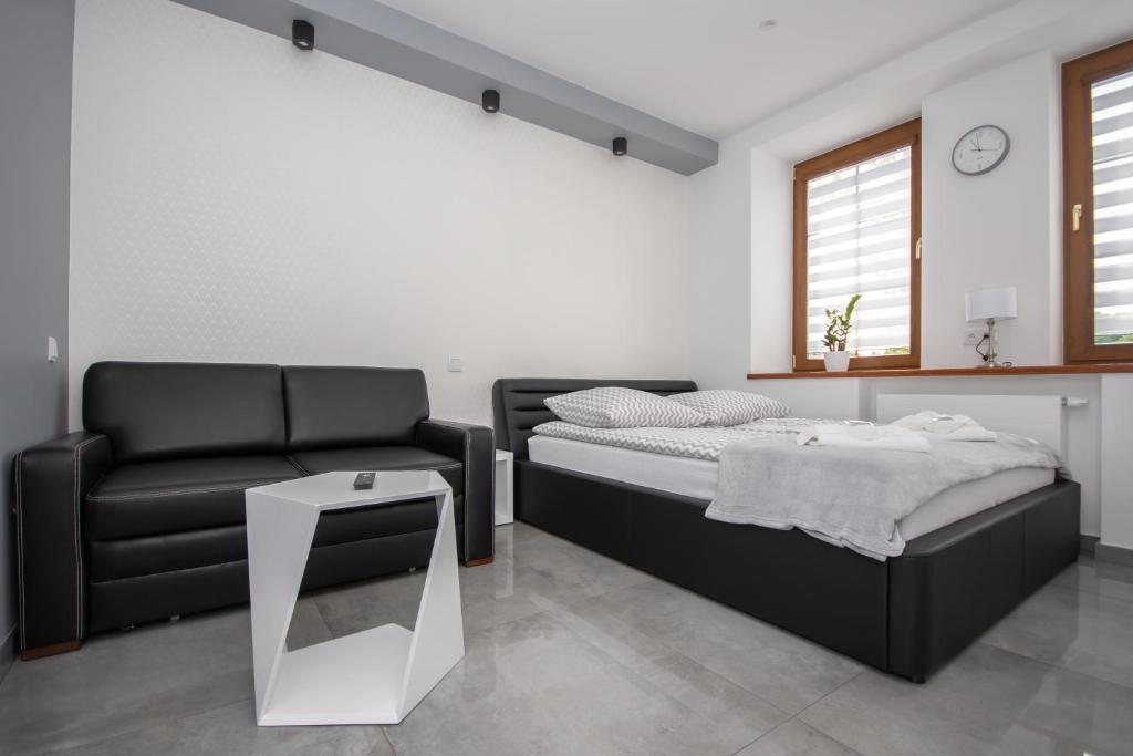 Posteľ alebo postele v izbe v ubytovaní Apartamenty AP 11