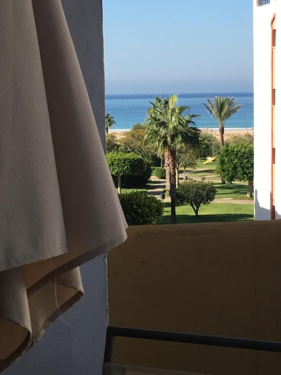 a view of the ocean from a balcony of a resort at Apartamento Zahara in Zahara de los Atunes