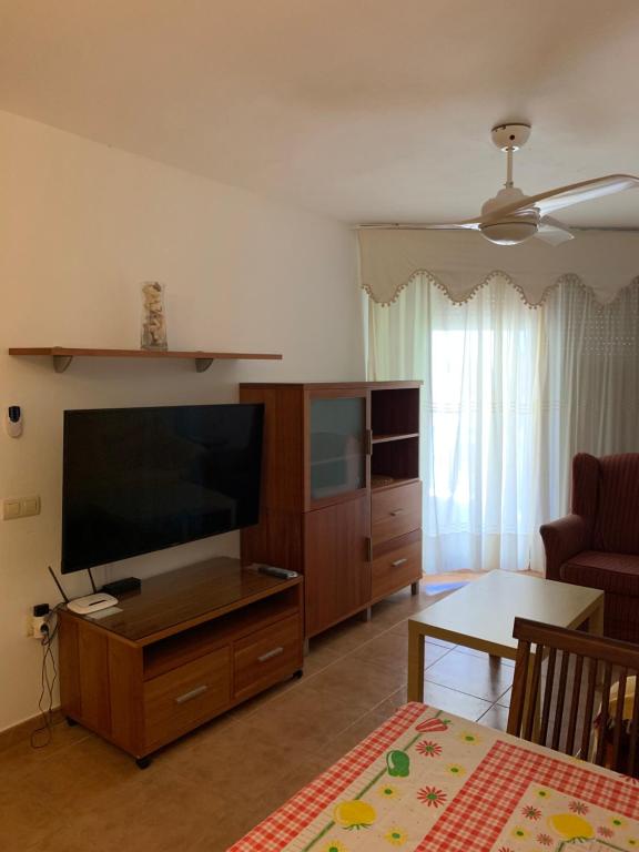 a living room with a large flat screen tv at Apartamento Zahara in Zahara de los Atunes