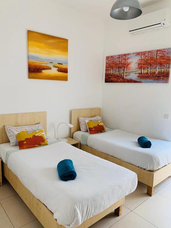 Postel nebo postele na pokoji v ubytování Hostel Malti Budget