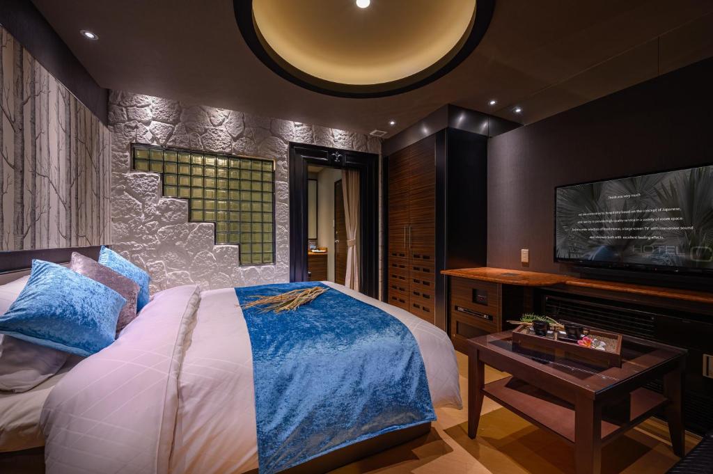 Postel nebo postele na pokoji v ubytování HOTEL C.KOHOKU