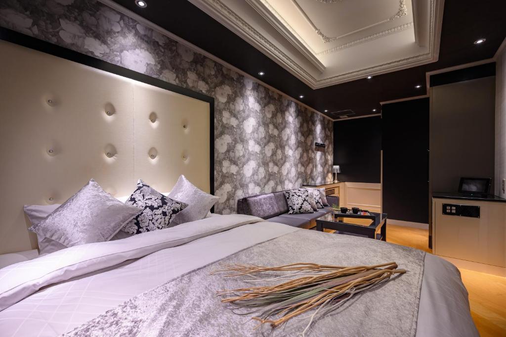 Postel nebo postele na pokoji v ubytování HOTEL C.KOHOKU
