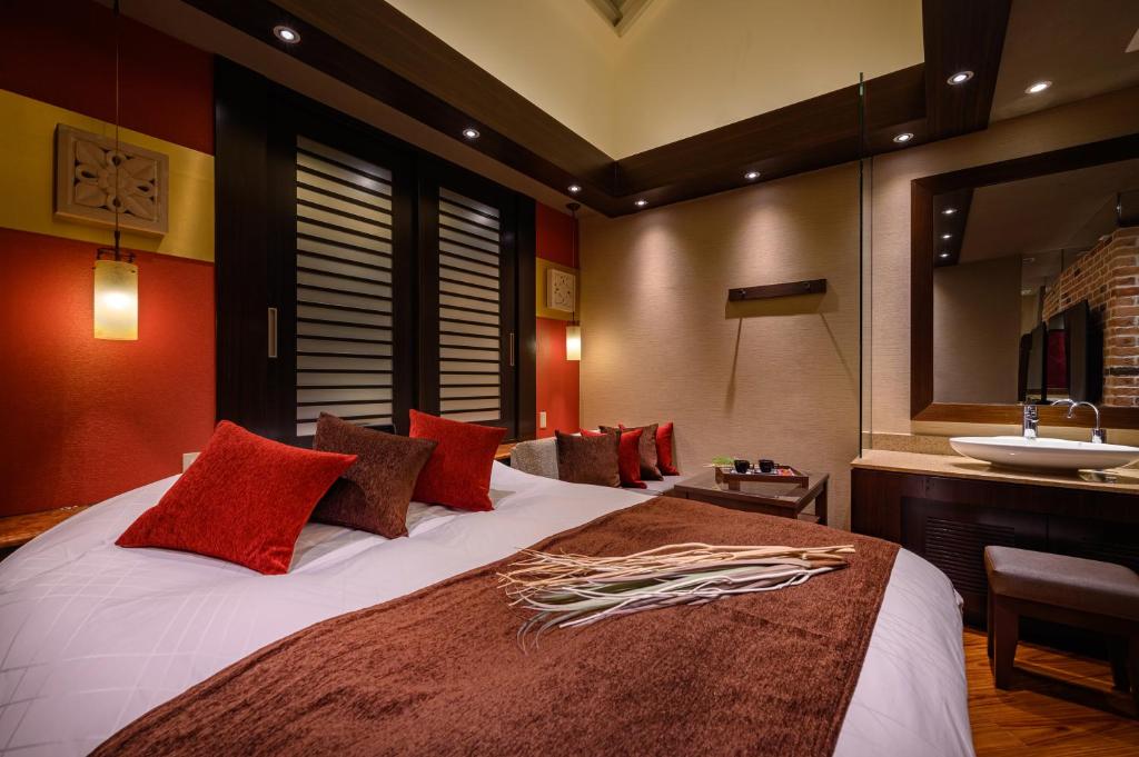 Postel nebo postele na pokoji v ubytování HOTEL C.KOHOKU