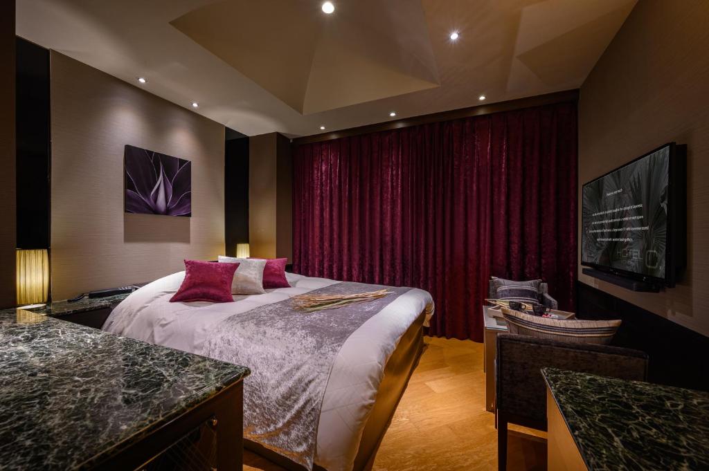 Postel nebo postele na pokoji v ubytování HOTEL C.KOHOKU