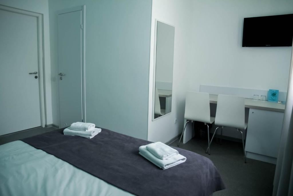 Postel nebo postele na pokoji v ubytování Volna Hotel