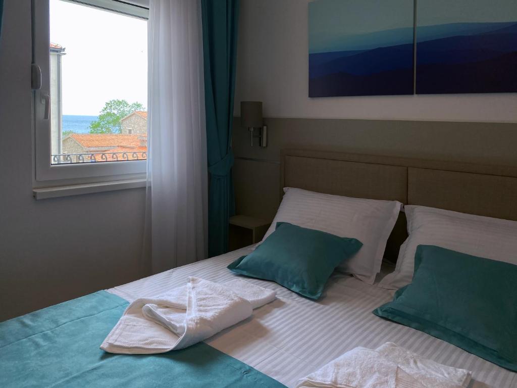 Ένα ή περισσότερα κρεβάτια σε δωμάτιο στο Family Beachfront Apartment