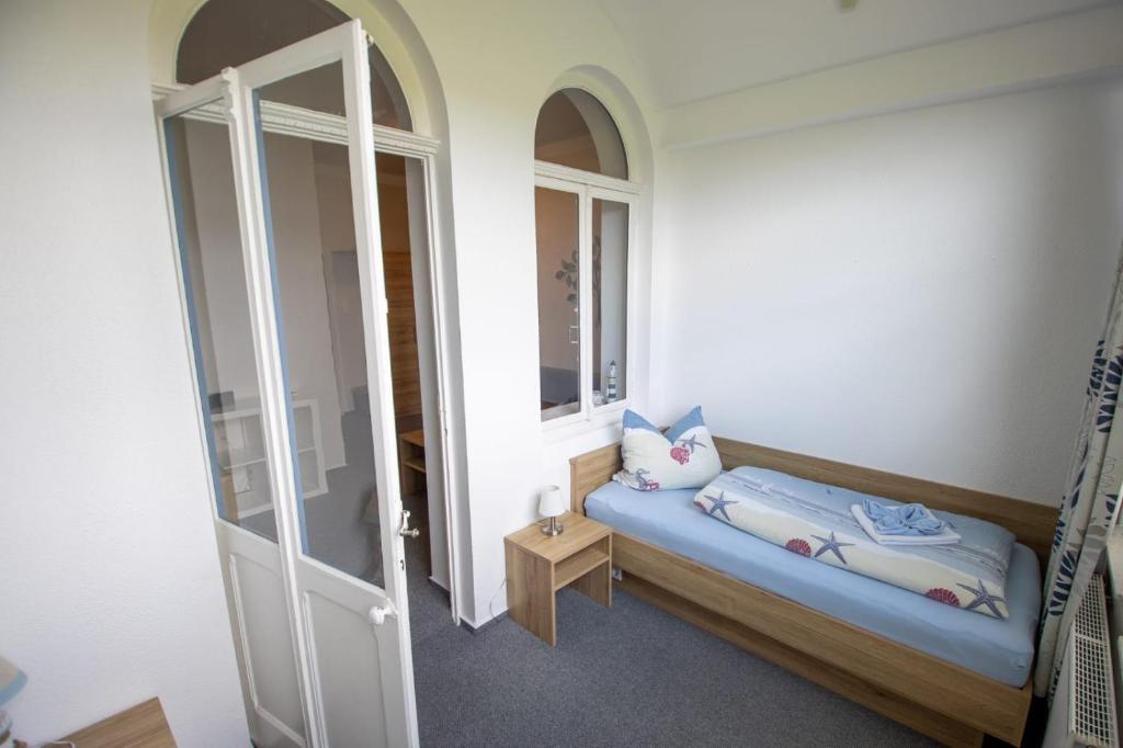 Postel nebo postele na pokoji v ubytování Hotel Norden Norddeich