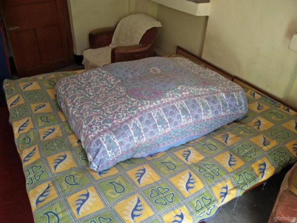 Postel nebo postele na pokoji v ubytování StayApart - Kailash View Homestay
